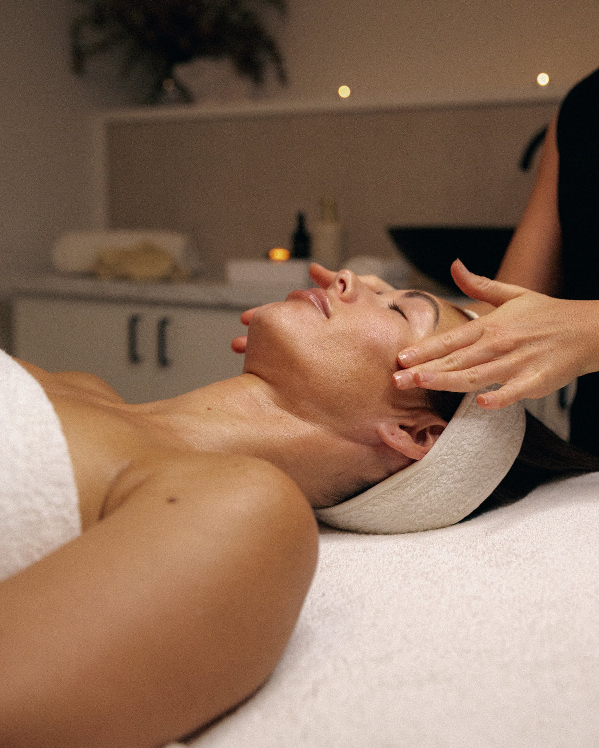 Person receiving a lymphatic facial massage at LADA Beauty spa, serving El Paso, TX