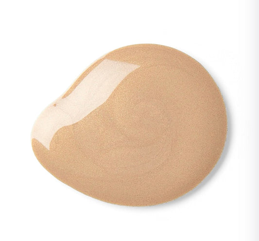 Beige tinted sunscreen sample with a white center on a light gray background, available at LADA Beauty serving El Paso, TX